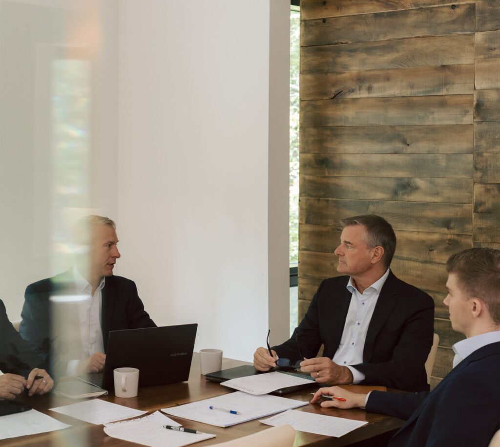 Business owners reviewing financial reports during advisory session